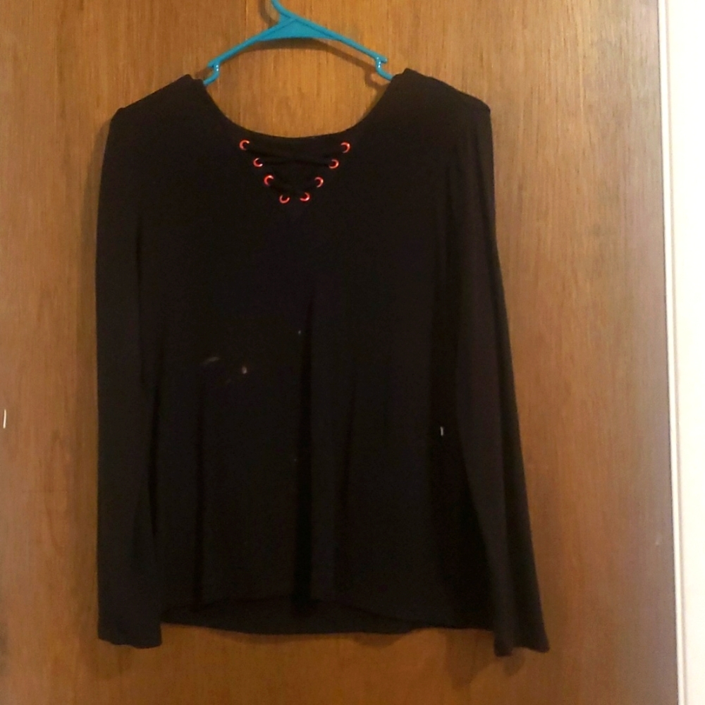 Black long sleeve, with crisscross ribbon at the top